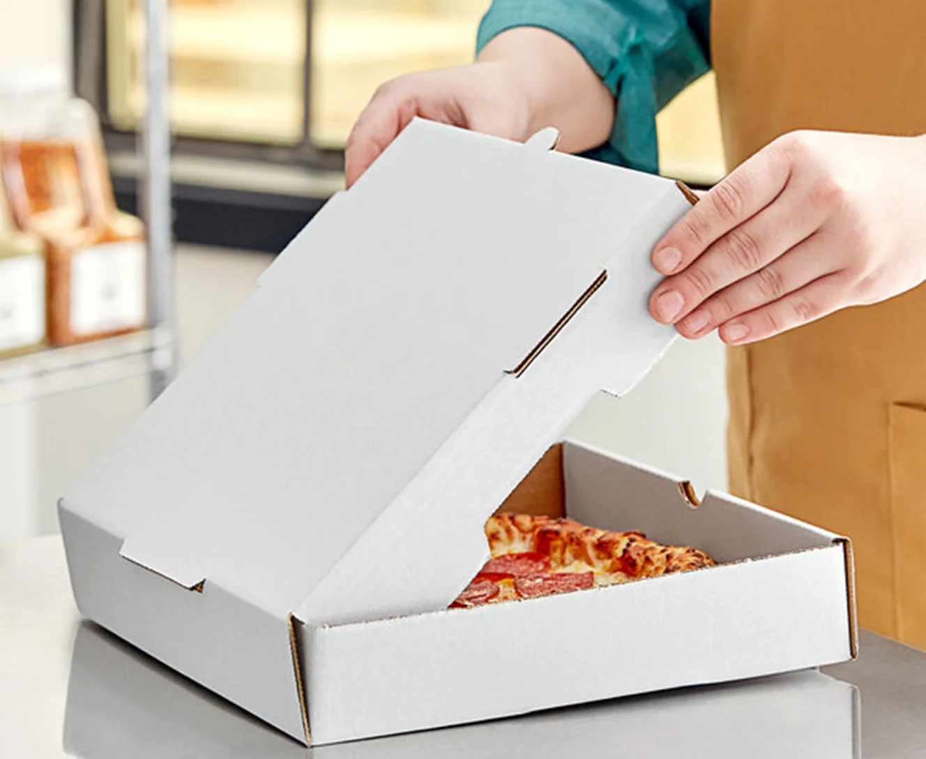 O material da caixa de pizza personalizada.